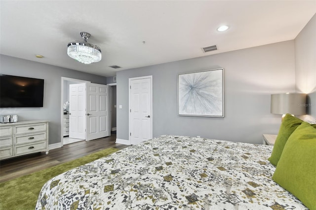 bedroom with dark wood-type flooring