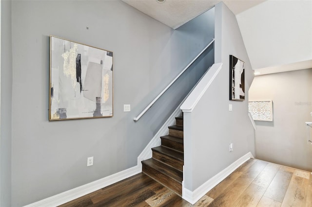 stairs with hardwood / wood-style floors