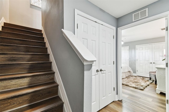 staircase featuring hardwood / wood-style floors