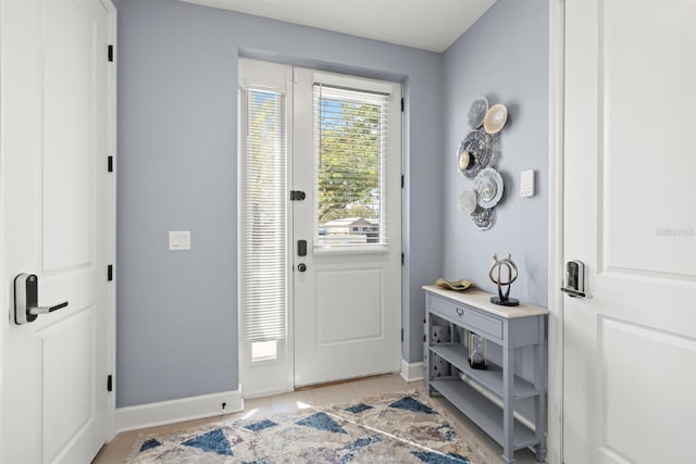 foyer featuring light tile patterned flooring