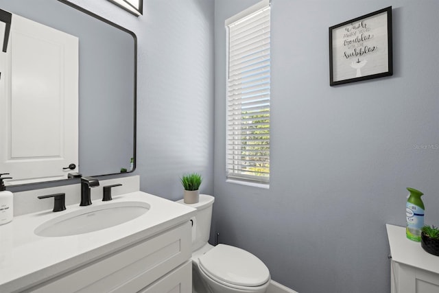 bathroom with vanity and toilet