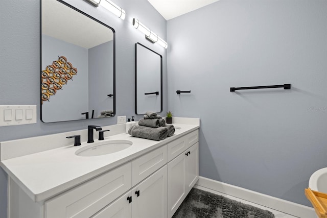 bathroom with vanity and tile patterned flooring