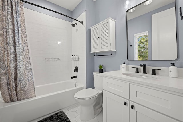 full bathroom featuring toilet, vanity, tile patterned floors, and shower / tub combo with curtain