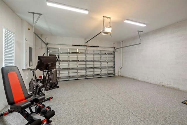 garage featuring a garage door opener and electric panel