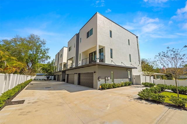 exterior space with a balcony and a garage