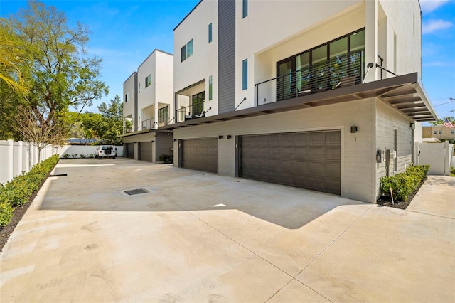 exterior space with a balcony and a garage