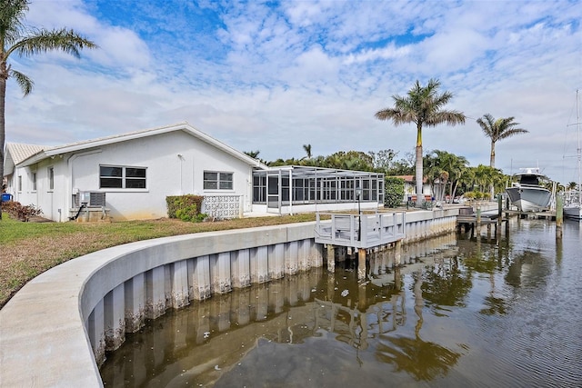 back of house with a water view