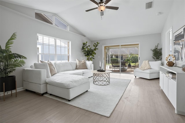 living room featuring ceiling fan, light hardwood / wood-style flooring, and high vaulted ceiling