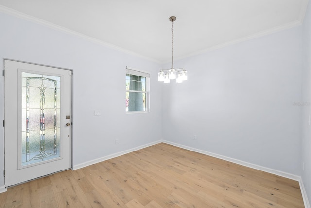 interior space with crown molding, light hardwood / wood-style flooring, and a chandelier