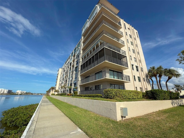 view of building exterior with a water view