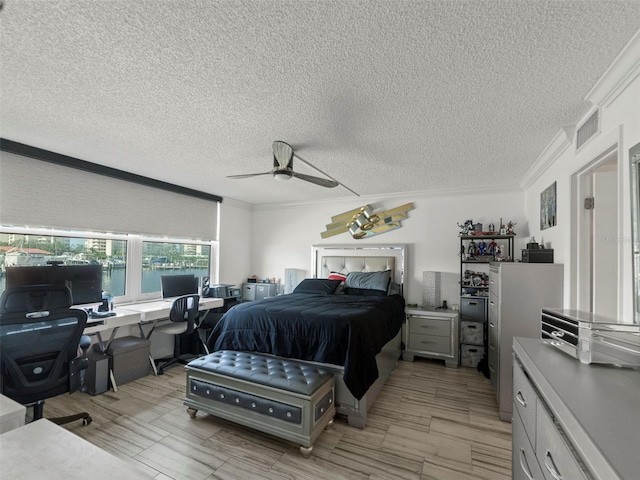 bedroom featuring ceiling fan, a textured ceiling, and crown molding