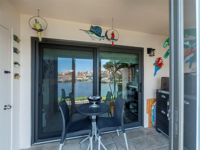 entrance to property featuring a water view