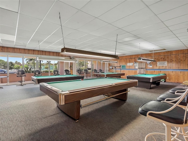 recreation room with wood walls, pool table, and carpet floors