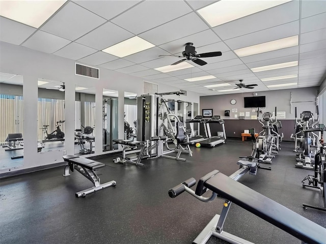 workout area featuring a paneled ceiling