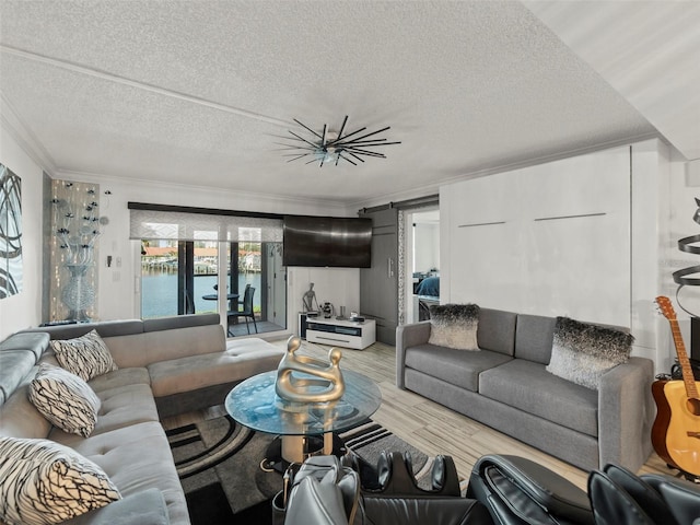 living room featuring ornamental molding, a textured ceiling, and light hardwood / wood-style floors