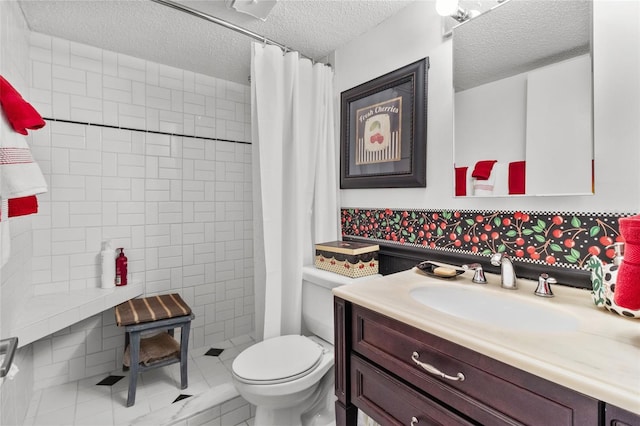 bathroom featuring vanity, walk in shower, a textured ceiling, and toilet