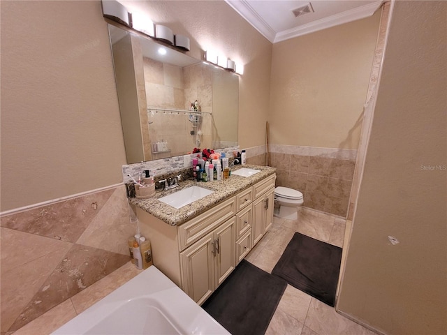 bathroom featuring a shower, vanity, toilet, and crown molding