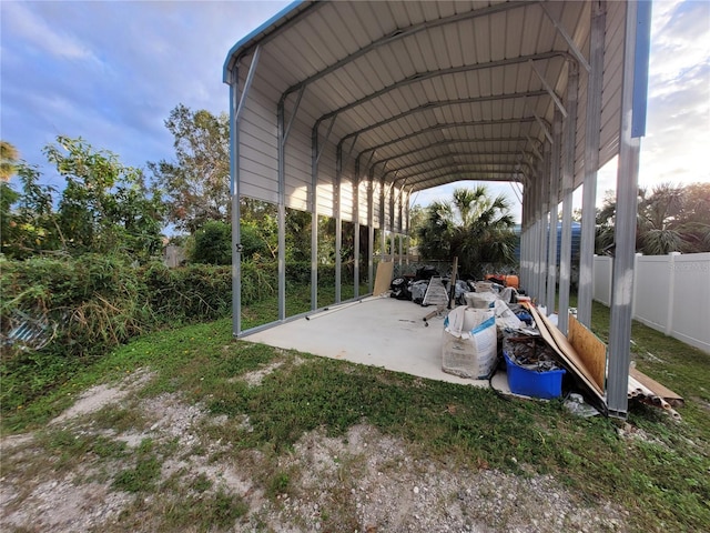 view of parking / parking lot featuring a carport