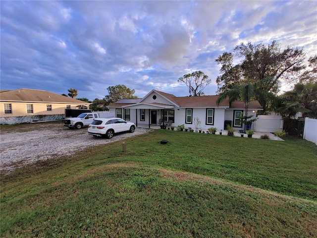 ranch-style house featuring a yard