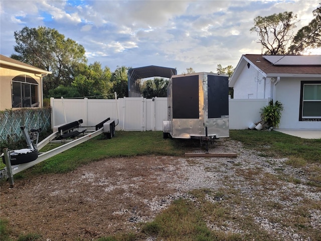 view of yard at dusk