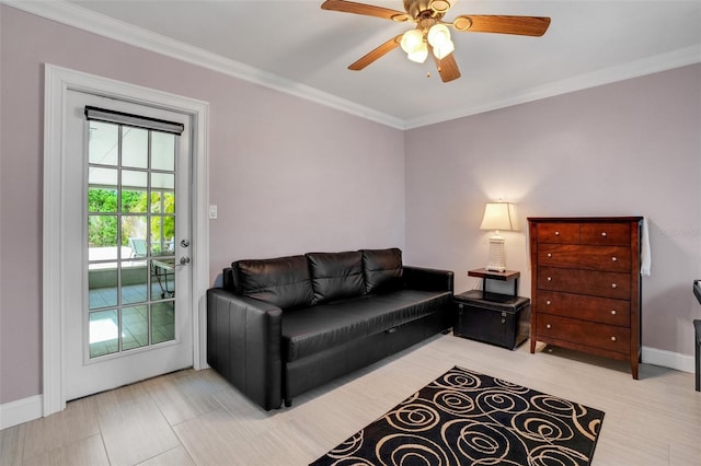 living room featuring ceiling fan and crown molding