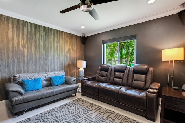 living room featuring ceiling fan, ornamental molding, and light tile patterned flooring