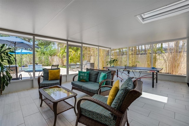 sunroom / solarium featuring a skylight