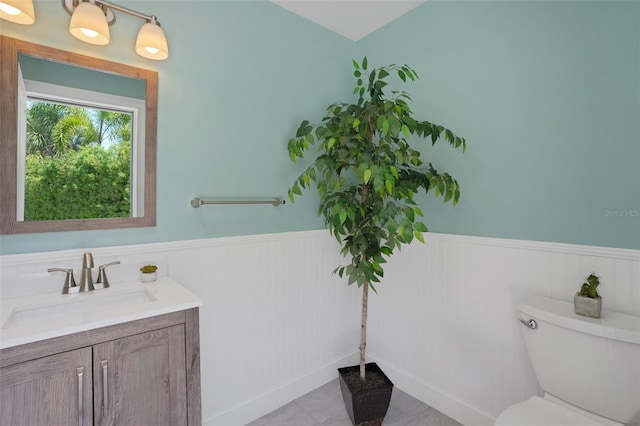 bathroom featuring vanity and toilet