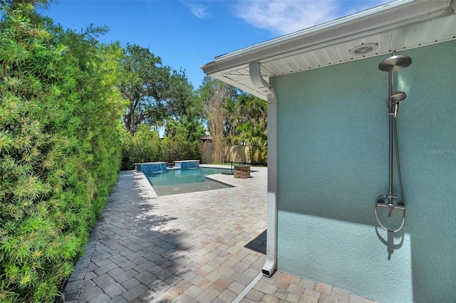 view of pool featuring a patio area