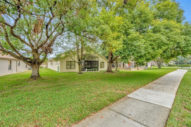 view of yard with a sunroom