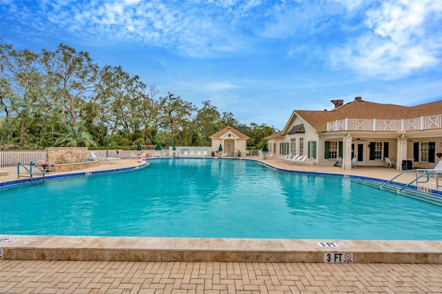 view of swimming pool with a patio area