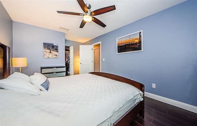 bedroom featuring dark hardwood / wood-style flooring and ceiling fan