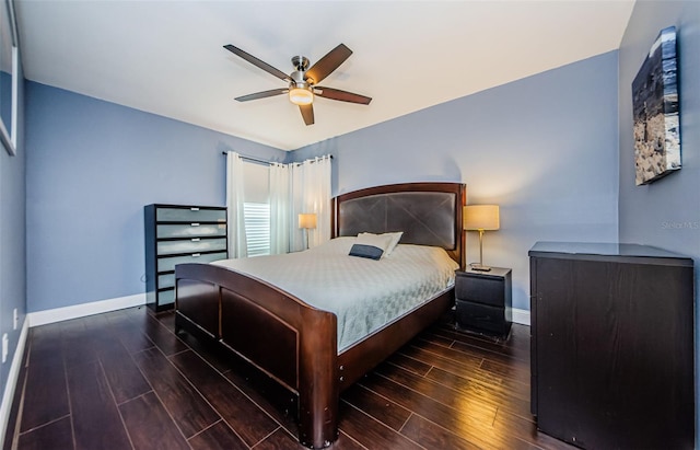 bedroom with ceiling fan and dark hardwood / wood-style floors