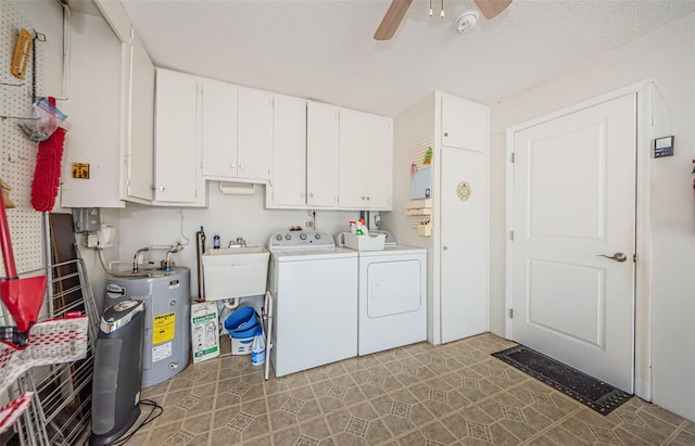 laundry room with water heater, cabinets, sink, independent washer and dryer, and ceiling fan