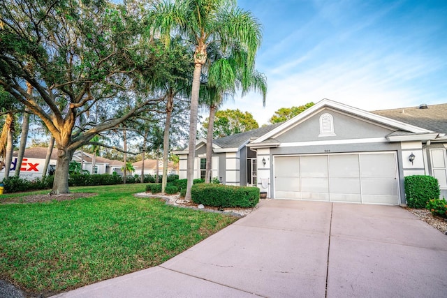 single story home with a garage and a front yard