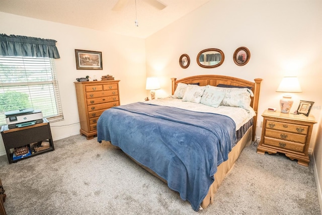 bedroom with lofted ceiling, light carpet, and ceiling fan