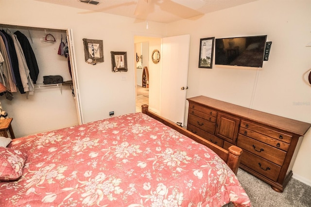 bedroom featuring light carpet and a closet