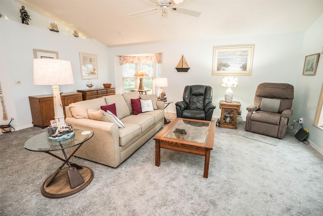 carpeted living room with ceiling fan and lofted ceiling