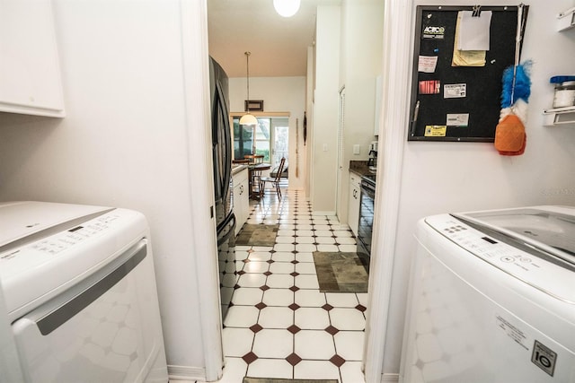 laundry room with separate washer and dryer