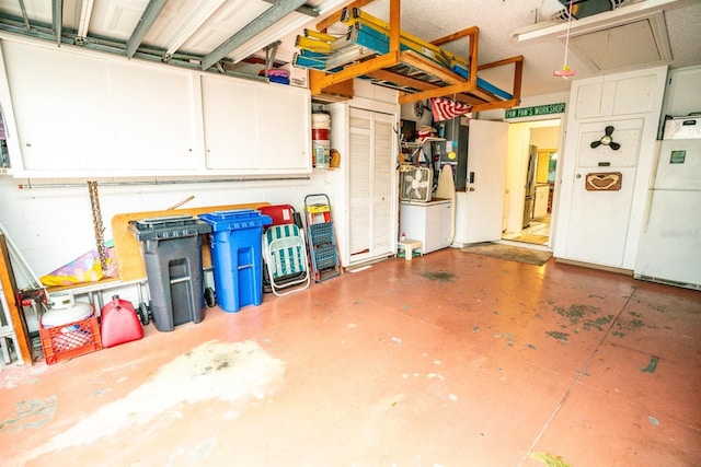 garage featuring white refrigerator