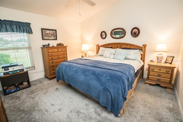 bedroom featuring lofted ceiling, ceiling fan, and carpet