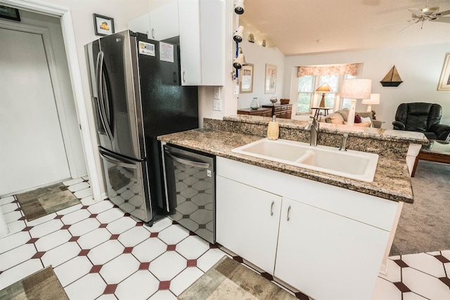 kitchen featuring white cabinetry, dishwasher, sink, and kitchen peninsula