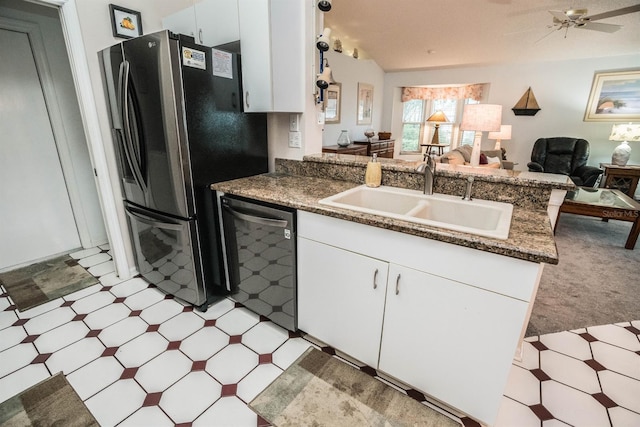 kitchen with white cabinets, stainless steel refrigerator, sink, and dishwasher