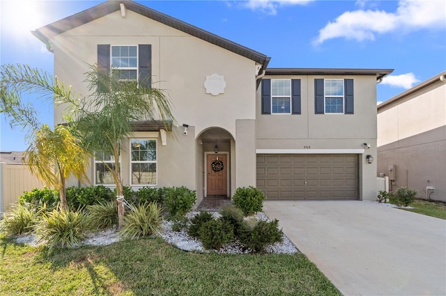 8968 Parsons Hill Blvd, Wesley Chapel, FL 33545 - view of front facade with stucco siding, driveway, and an attached garage