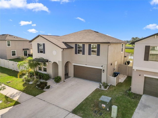 view of front of home with a garage and a front lawn