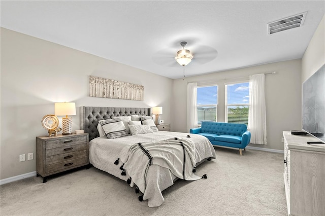 bedroom with ceiling fan and light colored carpet