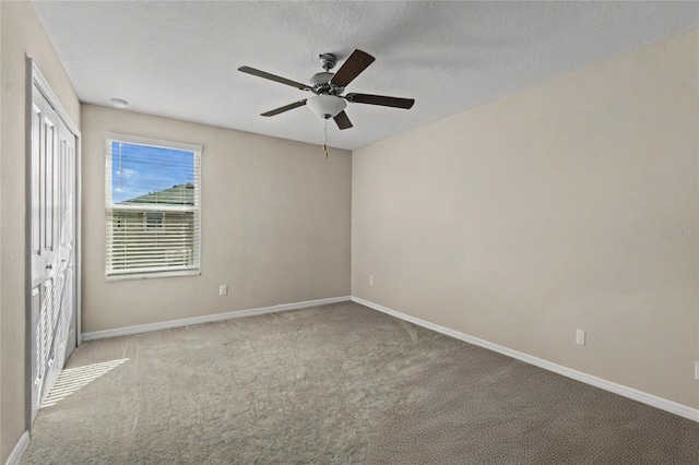 8968 Parsons Hill Blvd, Wesley Chapel, FL 33545 - unfurnished bedroom featuring carpet floors, baseboards, a closet, and a textured ceiling