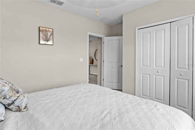 carpeted bedroom featuring a closet