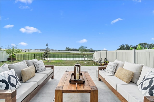 view of patio with outdoor lounge area and a water view