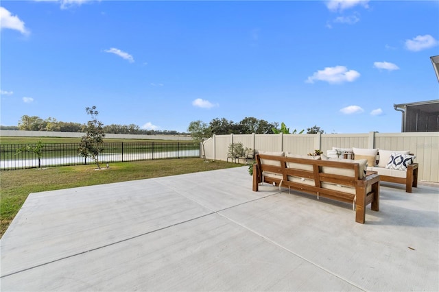 view of patio / terrace with a water view and an outdoor hangout area